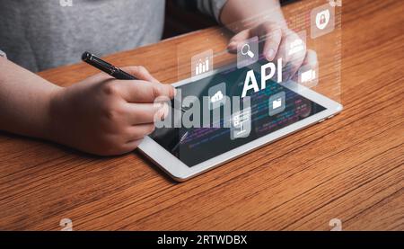 Woman using digital tablet with API application programming interface. Function and procedure development technology concept. Stock Photo