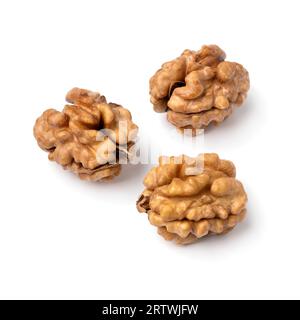 Three peeled walnut isolated on white background close up Stock Photo