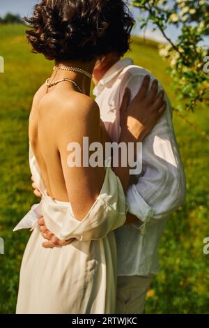 Brunette bride in a robe, posing for the camera, looking at her wedding  dress. Elegant hairstyle. Nice makeup. Voluminous veil. Morning of the  bride 36409244 Stock Photo at Vecteezy