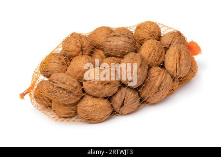 Net with whole walnuts in the shell isolated on white background close up Stock Photo