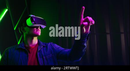 A man wearing a vr immersed in a virtual reality experience in a studio ...