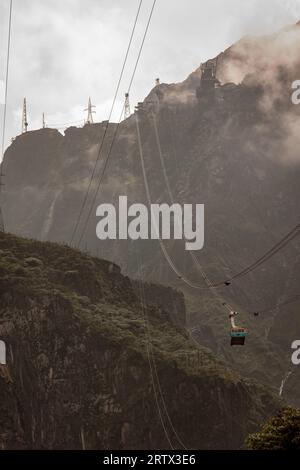 The cable cars against the rugged texture on the mountains near the Grasberg open pit mine in Papua, Indonesian highlands Stock Photo