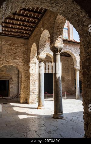 Courtyard of 6th century Euphrasian Basilica (Eufrazijeva bazilika) in the historic centre of Poreč on the Istrian Peninsula of Croatia Stock Photo