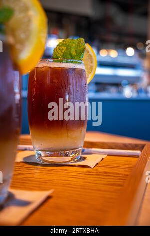 Cold Layered Coffee Drink With Lemon Slice And Mint Leaf. Lemonada 