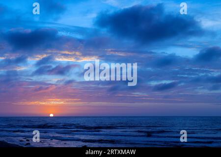 Sunset over the Atlantic Ocean, Henties Bay, Namibia Stock Photo