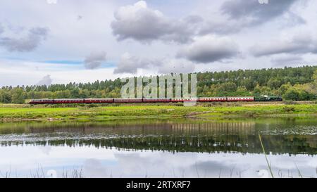 Boat of Garten, Scotland, UK. 15th September 2023. The Flying Scotsman steam train pulling coaches of steam train enthusiasts on the Strathspey railway between Aviemore and Broomhill. The special steam excursion marks the 100th anniversary of the most famous steam locomotive of all time.  Iain Masterton/Alamy Live News Stock Photo