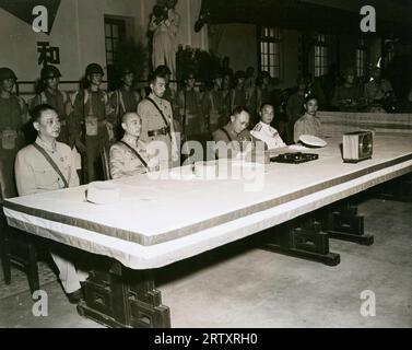 Photo shows Gen Ho Ying Chin signing the surrender terms that the Chinese submitted the Japanese officials when they met in Nanking, China for the signing of the Peace Terms and surrender at the Central Military Academy in Nanking - September 9, 1945 Stock Photo