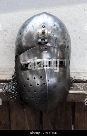 Medieval knight closed iron helmet close up photo with selective soft focus Stock Photo