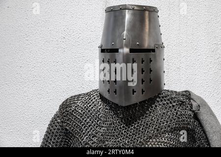 Armor of a Medieval crusader knight. Closed iron helmet and chain mail Stock Photo