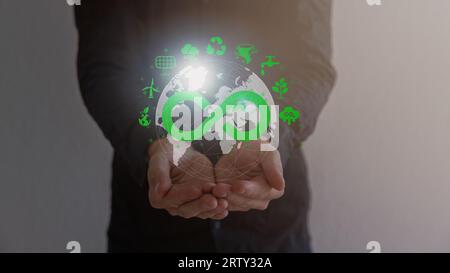 Businessman holding circular economy icon Circular economy concept for ...