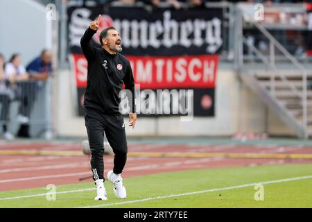 Nuremberg, Germany. 15th Sep, 2023. Soccer: 2nd Bundesliga, 1. FC Nuremberg - SpVgg Greuther Fürth, Matchday 6, Max Morlock Stadium. Nuremberg coach Cristian Fiel gives instructions on the sidelines. Credit: Daniel Löb/dpa - IMPORTANT NOTE: In accordance with the requirements of the DFL Deutsche Fußball Liga and the DFB Deutscher Fußball-Bund, it is prohibited to use or have used photographs taken in the stadium and/or of the match in the form of sequence pictures and/or video-like photo series./dpa/Alamy Live News Stock Photo