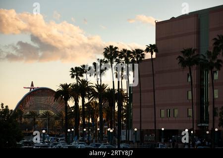 Anaheim, California, USA - March 1, 2023: Sunset descends on palm trees and the Anaheim Regional Transportation Intermodal Center (ARTIC) in downtown Stock Photo