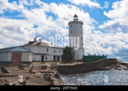 Tolbukhin island lighthouse, Saint-Petersburg, Kronstadt, Gulf of Finland view, Russia in summer sunny day, lighthouses of Russia travel Stock Photo