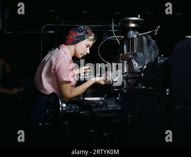 Women become skilled shop technicians after careful training in the school at the Douglas Aircraft Company plant, Long Beach, Calif. (1942). Stock Photo