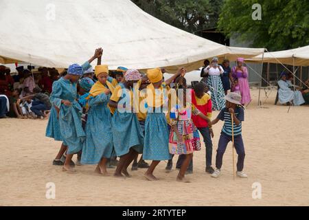 Okombahe: King's Festival of the Damara: Dance group, young women in traditional clothing dancing for the king, Erongo Region, Namibia Stock Photo