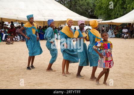 Okombahe: King's Festival of the Damara: Dance group, young women in traditional clothing dancing for the king, Erongo Region, Namibia Stock Photo