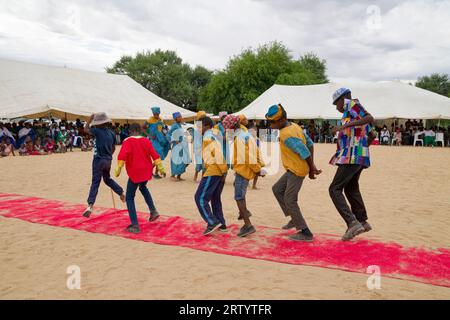 Okombahe: King's Festival of Damara: Boys dance for the king, Erongo region, Namibia Stock Photo