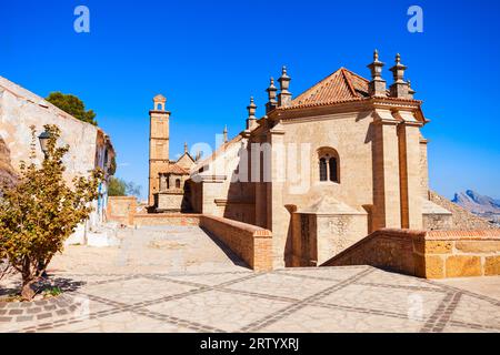 Statue of Pedro Espinosa in the Plaza de Santa Maria with a pavement cafe  and the giants arch to the rear, Antequera, Spain Stock Photo - Alamy