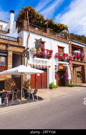 Capileira, Spain - October 21, 2021: Beauty street cafe in Capileira village. Capileira is the highest village in the Alpujarras area in the province Stock Photo