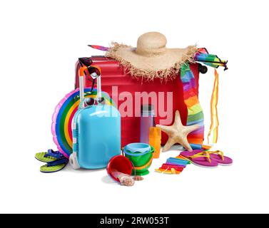Suitcases, straw hat, inflatable ring and other beach accessories isolated on white Stock Photo