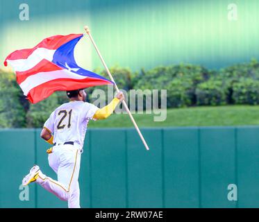 Pittsburgh Pirates right fielder Joshua Palacios carries the flag of ...