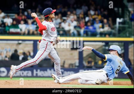 Washington Nationals shortstop CJ Abrams yawns behind his glove