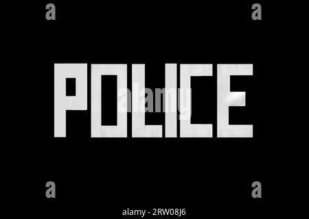 Inscription police in white letters, symbol, sign of the fight against crime on a black background. Stock Photo