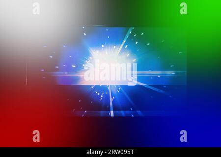 Bright white glare light spot at the end of the tunnel in darkness black colorful background. Stock Photo