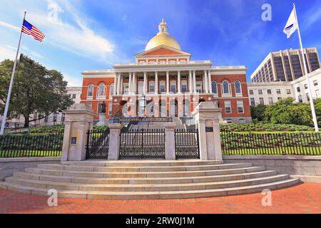 Massachusetts State House and State Library. Imposing red building with white columns and golden dome. Stock Photo