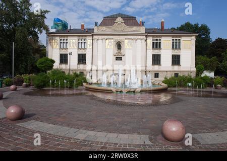 Szczepanski Square with fountain and Palace of the Arts, opened in 1901 in Krakow, Poland Stock Photo
