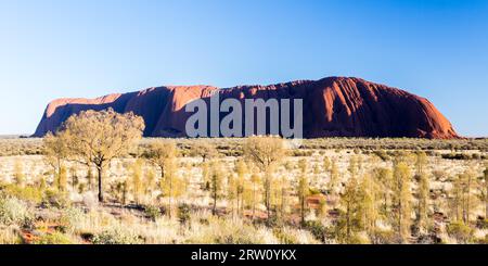 Majestic Uluru at sunrise on a clear winter#39, s morning in the Northern Territory, Australia Stock Photo