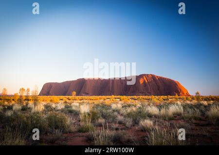 Majestic Uluru at sunrise on a clear winter's morning in the Northern Territory, Australia Stock Photo