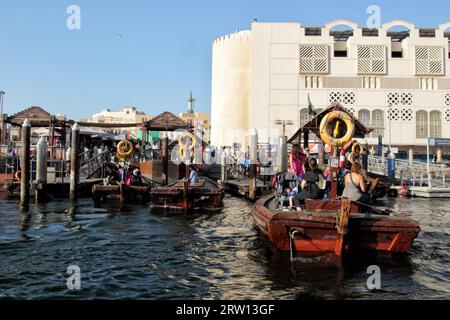 Abras, the typical water taxis of Dubai, at the jetty on the Bur Dubai side of Dubai Creek, Dubai, United Arab Emirates Stock Photo