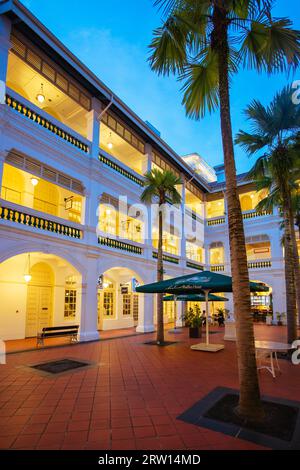 Singapore, Singapore, June 22nd 2015: The famous and historic Raffles hotel on a warm sunny evening in Singapore Stock Photo