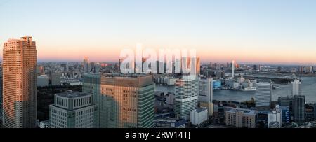 Tokyo, Japan, December 18, 2014: Panoramic view of Tokyo skyline with harbour during sunset Stock Photo