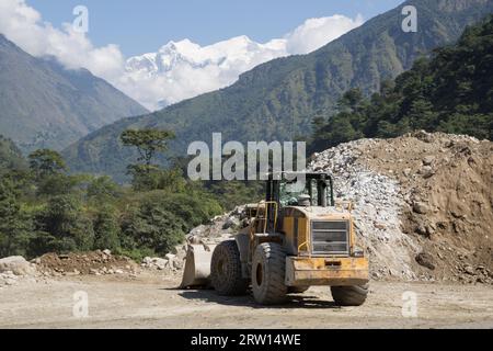 Bhulbhule, Nepal, October 23, 2015: A wheel loader on a hydropower plant construction site in the Annapurna Region Stock Photo