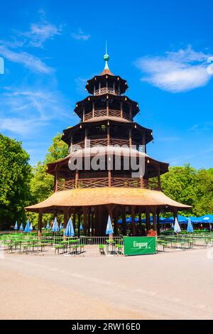 Munich, Germany - July 06, 2021: Chinese Tower or Chinesischer Turm is a 25 metre high wooden tower in the English Garden or Englischer Garten, a publ Stock Photo