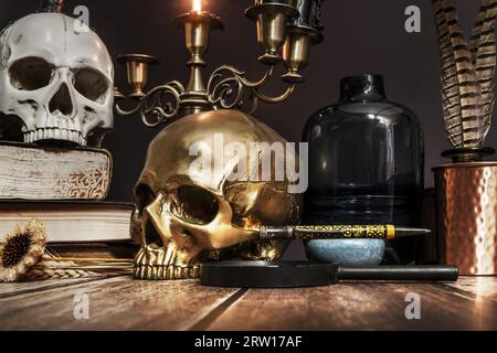 A close still life of some skulls, some old books and vintage desk objects Stock Photo