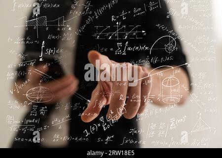 Businessman writing math formulas finger Stock Photo