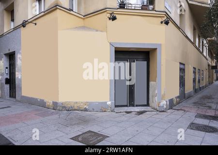 Facades of a commercial premises on the corner with paint in need of renovation Stock Photo