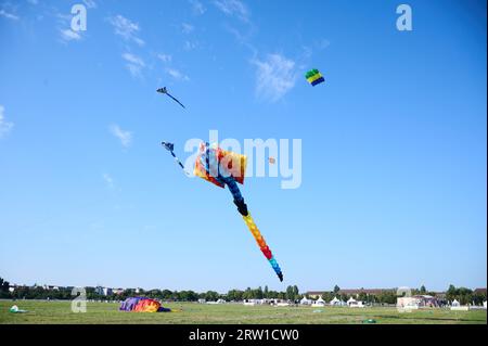 Berlin, Germany. 16th Sep, 2023. Kites fly in the late summer blue sky at the 10th Festival of Giant Kites at Tempelhofer Feld. Credit: Annette Riedl/dpa/Alamy Live News Stock Photo