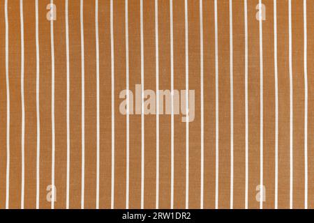 Striped orange white fabric texture background wtih copy space. Shirt fabric, tablecloth textile, garment cloth, upholstery with classic pattern with Stock Photo