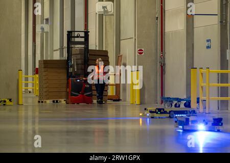 02.05.2023, Germany, Bremen, Bremen - AGV driverless transport system with AMR (Autonomous Mobile Robots) in the logistics centre C3 Bremen (BLG Logis Stock Photo
