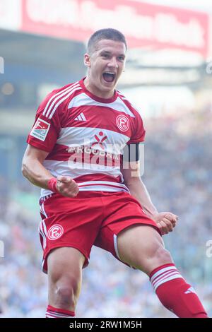 Rostock, Germany. 16th Sep, 2023. Soccer: 2nd Bundesliga, Hansa Rostock - Fortuna Düsseldorf, Matchday 6, Ostseestadion. Düsseldorf's Christos Tzolis celebrates his goal to make it 0:1 in front of his own fans. Credit: Gregor Fischer/dpa - IMPORTANT NOTE: In accordance with the requirements of the DFL Deutsche Fußball Liga and the DFB Deutscher Fußball-Bund, it is prohibited to use or have used photographs taken in the stadium and/or of the match in the form of sequence pictures and/or video-like photo series./dpa/Alamy Live News Stock Photo