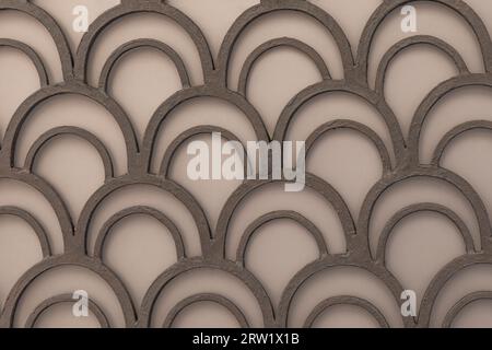 Light coloured cream background with metal arches Stock Photo
