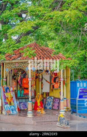 Puttaparthi, India - September 01.2023: Sai Baba Temple of Puttaparthi decorated with pictures of Sai Baba and flowers, vertical Stock Photo