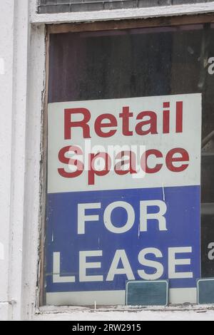 Retail space for lease. Signboard on an old property mall. Property leasing or real estate concept. Copy space for text. Stock Photo