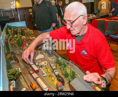 Troon, UK. 16th Sep, 2023. Ayr Model Railway Group held its annual model railway show in Troon, Scotland, UK with exhibits and sets constructed by individuals and other model clubs from across Scotland. Image of John Mendie from Falkirk Model railway Club working on his 'tt' gauge model of Smierweida. Credit: Findlay/Alamy Live News Stock Photo