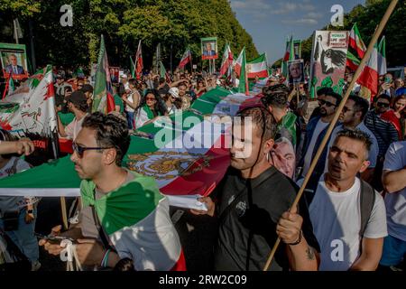 Berlin, Germany. 16th Sep, 2023. The area surrounding Berlin's iconic Victory Column was a sea of protesters on September 16, 2023; many held aloft images of Reza Pahlavi, the Crown Prince of Iran. The gathering marked the first anniversary of the tragic death of Mahsa Amini, a 22-year-old Iranian woman who died in the custody of Iran's morality police. Reza Pahlavi, the exiled son of Iran's last shah, has been a vocal critic of the Iranian regime. (Photo by Michael Kuenne/PRESSCOV/Sipa USA) Credit: Sipa USA/Alamy Live News Stock Photo