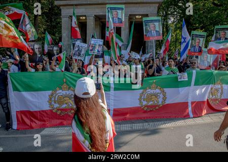 Berlin, Germany. 16th Sep, 2023. The area surrounding Berlin's iconic Victory Column was a sea of protesters on September 16, 2023; many held aloft images of Reza Pahlavi, the Crown Prince of Iran. The gathering marked the first anniversary of the tragic death of Mahsa Amini, a 22-year-old Iranian woman who died in the custody of Iran's morality police. Reza Pahlavi, the exiled son of Iran's last shah, has been a vocal critic of the Iranian regime. (Photo by Michael Kuenne/PRESSCOV/Sipa USA) Credit: Sipa USA/Alamy Live News Stock Photo